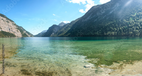Stunning deep green waters of Konigssee, known as Germanys deepest and cleanest lake, located in the extreme southeast Berchtesgadener Land district of Bavaria, near the Austrian border.