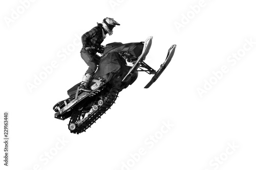 Canvas Print Freestyle motocross rider on snowmobile jump at fmx competitions (isolated on wh