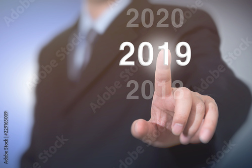 Businessman pointing year 2019. Businessman new year concept.