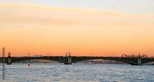 Troitsky bridge. Autumn city skyline at sunset, Neva river.
