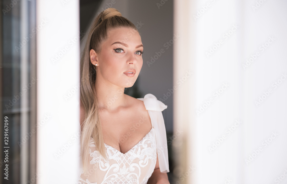 Bride looking through a window Bride looking through a window