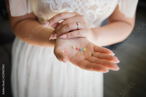 Bride showing word love in her hands photo