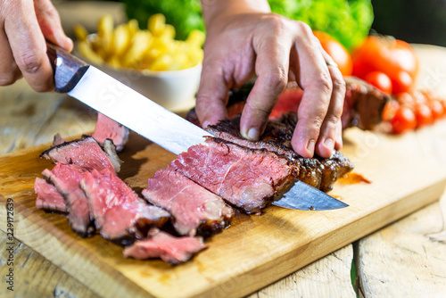 Beef steak cut on chopping board