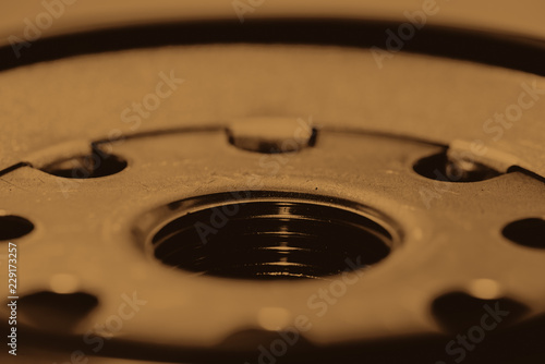 Monochrome background image of oil filter close up. Artwork from auto part in macro photography in sepia tones.