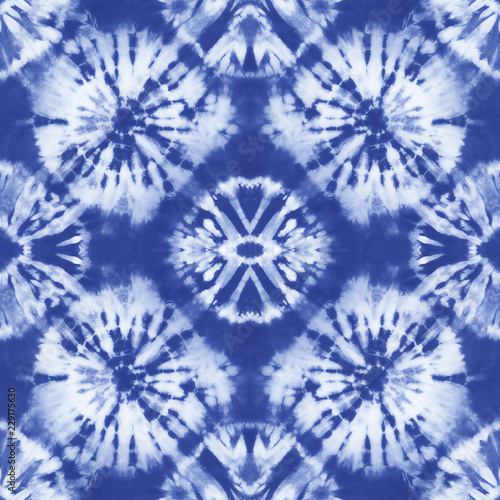 Seamless pattern, abstract tie dyed fabric of indigo color on white cotton. Hand painted fabrics. Shibori dyeing