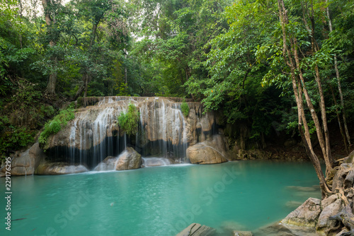 Fototapeta Naklejka Na Ścianę i Meble -  Breathtaking green waterfall at deep forest, Erawan waterfall located Kanchanaburi Province, Thailand