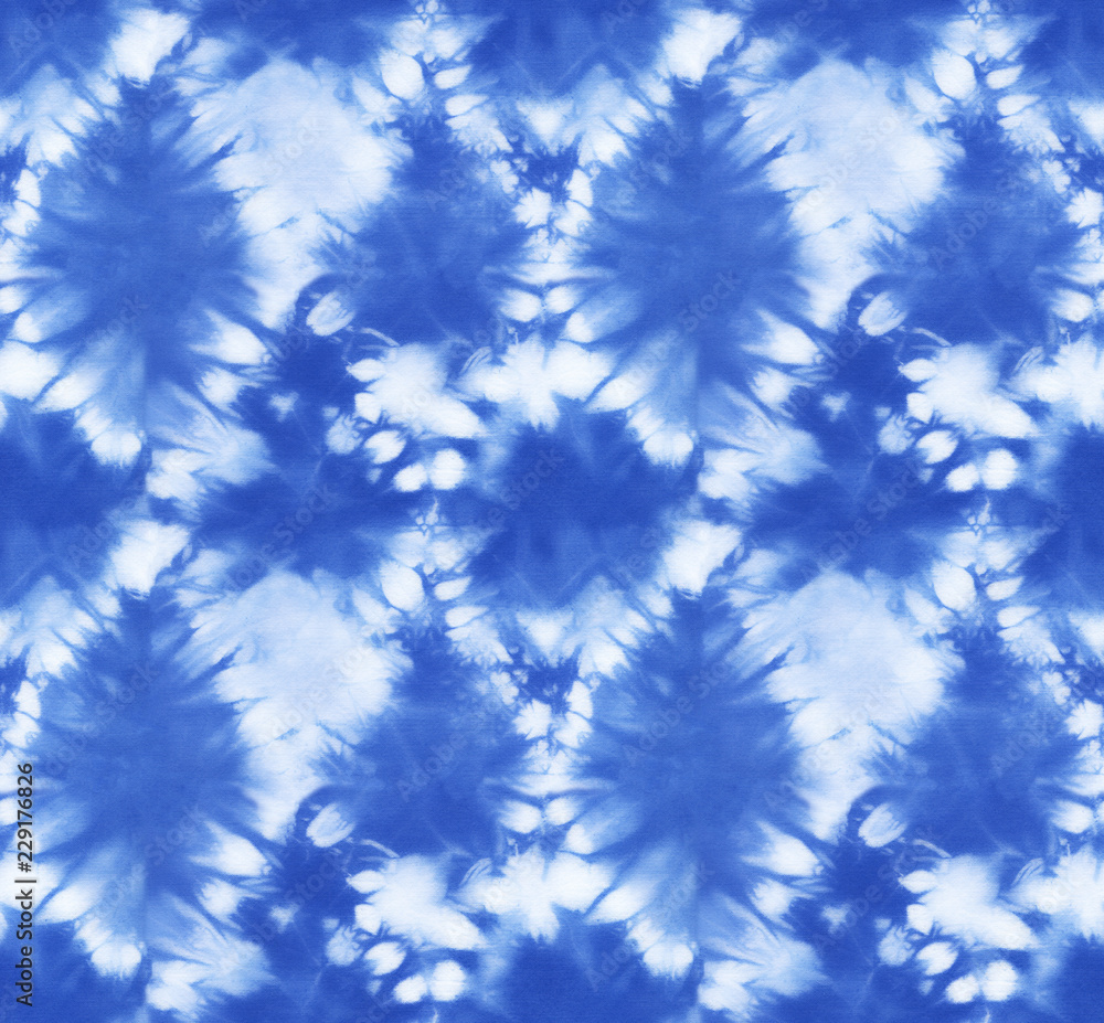 Seamless pattern, abstract tie dyed fabric of indigo color on white cotton. Hand painted fabrics. Shibori dyeing Seamless pattern, abstract tie dyed fabric of indigo color on white cotton. Hand painted fabrics. Shibori dyeing