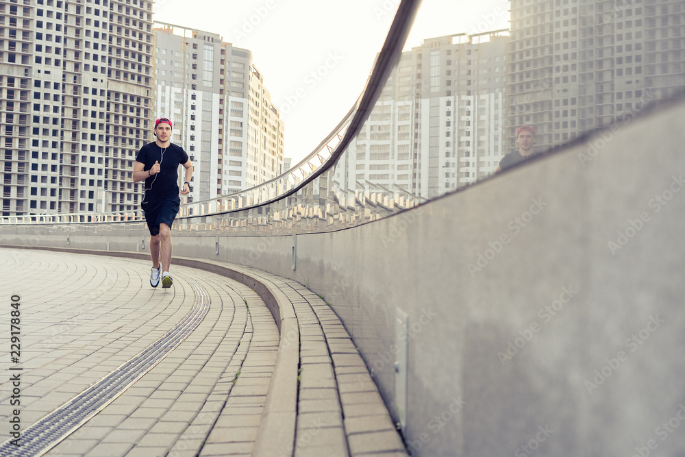 Fit athlete running outdoors to stay healthy Fit athlete running outdoors to stay healthy