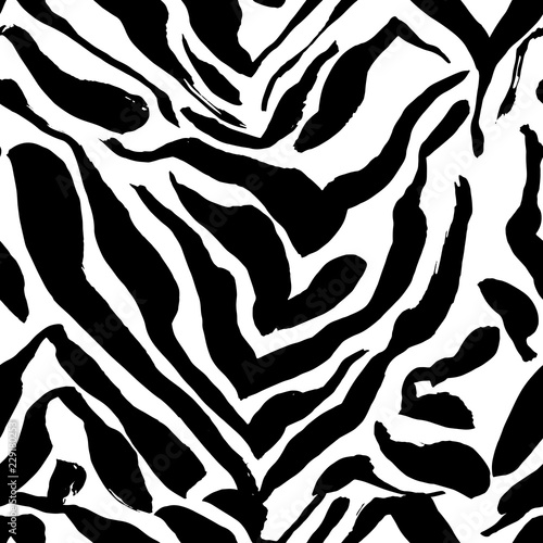 Brush painted zebra seamless pattern. Black and white stripes grunge background.