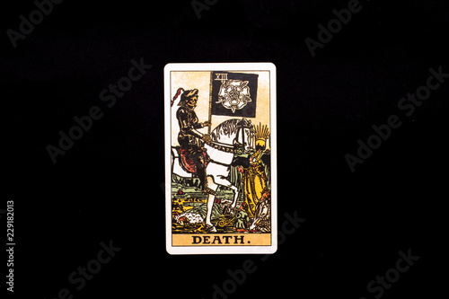 An individual major arcana tarot card isolated on black background. Death.