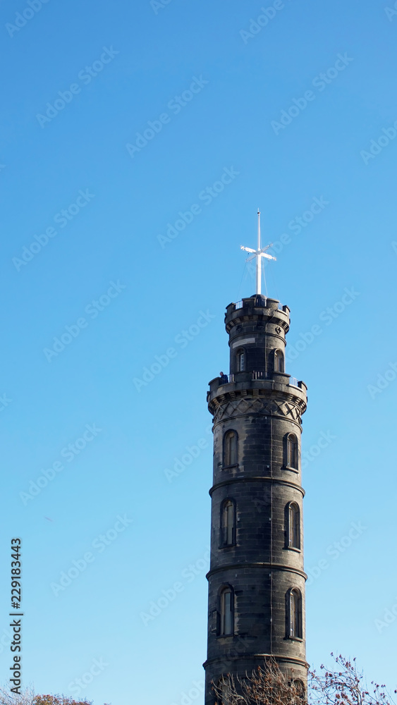 The Nelson Monument on Calton Hill in Edinburgh on a bright autumn day.