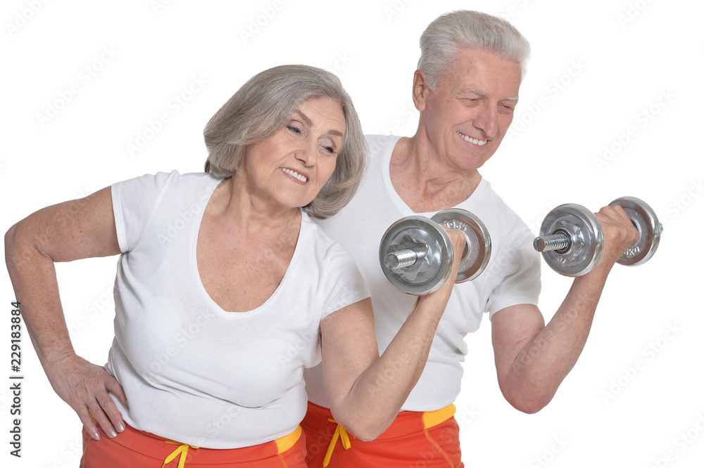 Portrait of a senior couple exercising on white background Portrait of a senior couple exercising on white background
