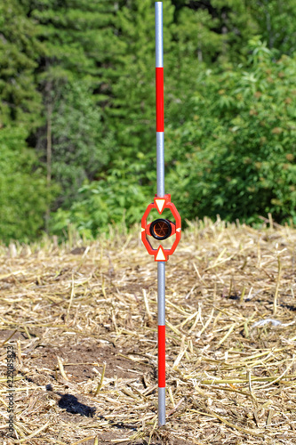 Practical use outdoor of mini-prisms on the mini-milestone for total station © Krugloff