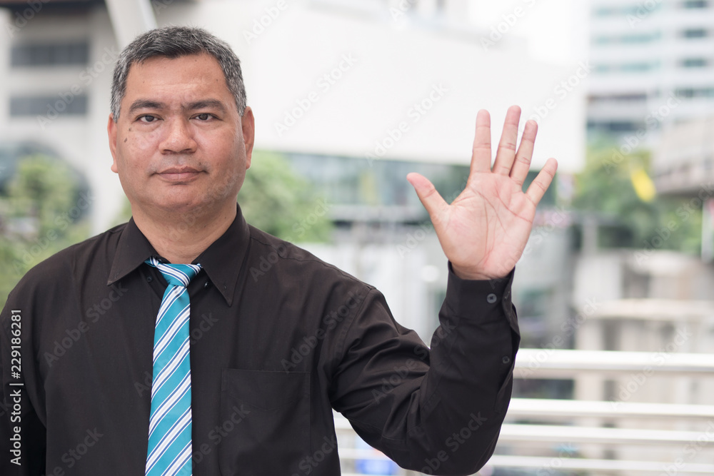happy old man pointing up five fingers; retired pensioner counting, numbering with finger point; senior old man points five fingers up portrait; southeast old senior man model happy old man pointing up five fingers; retired pensioner counting, numbering with finger point; senior old man points five fingers up portrait; southeast old senior man model