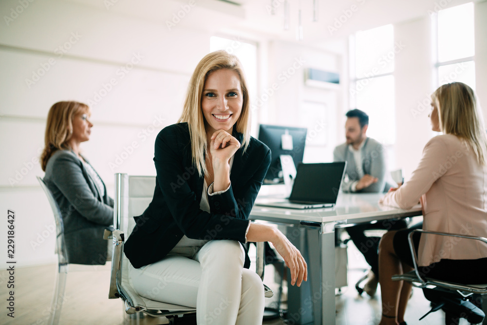 Picture of attractive sales workers on meeting in office Picture of attractive sales workers on meeting in office