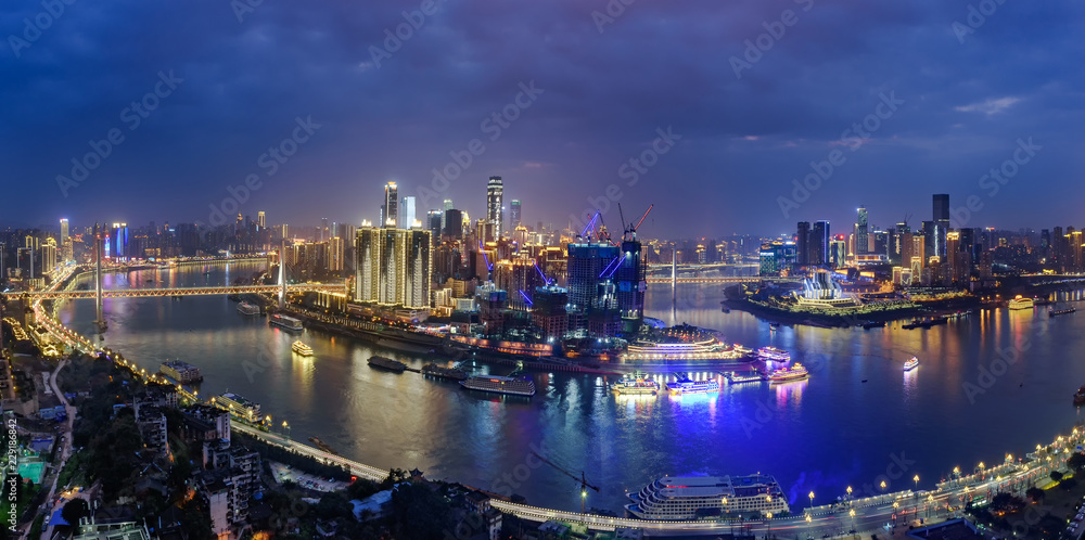The nightscape of Chongqing Chaotianmen harbor where the Yangtze rive and Jialing river meet .