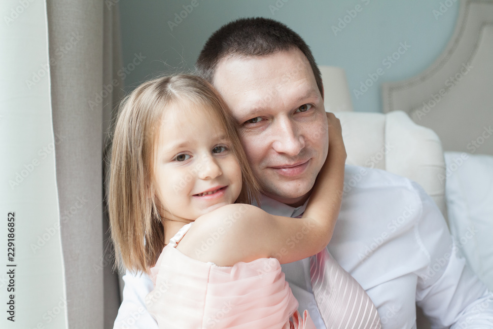 Fototapeta premium Father and daughter hugging, portrait
