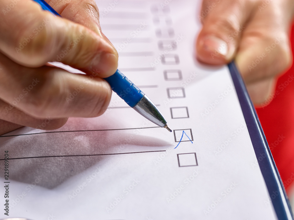A man works with a checklist. A man works with a checklist.