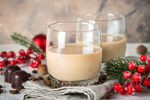 Irish creme liqueur in glass with christmas decorations. photo