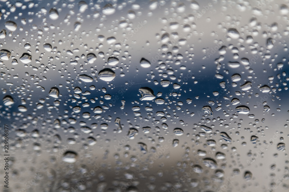 rain drops on car glass, abstract background rain drops on car glass, abstract background