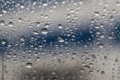 rain drops on car glass, abstract background