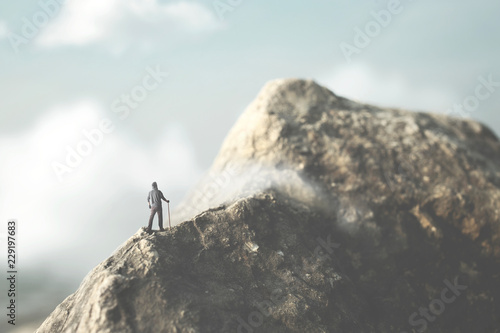 man reach the top of the mountain