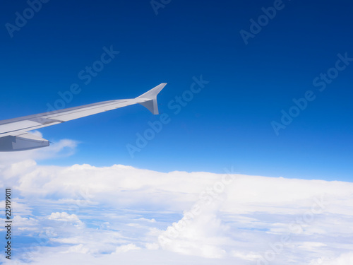 air craft wing above the white cloud sky space © appleyayee