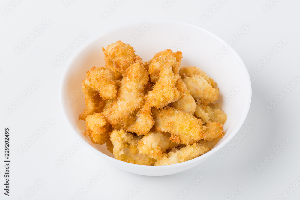 fried chicken nuggets in the white bowl on white background fried chicken nuggets in the white bowl on white background