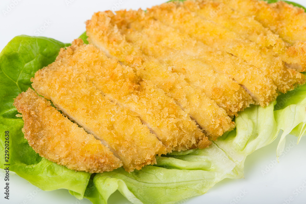 close-up of chicken cutlet on a white background close-up of chicken cutlet on a white background