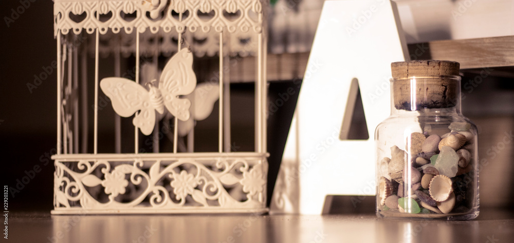 Detail composition with cage and letters for decoration Detail composition with cage and letters for decoration
