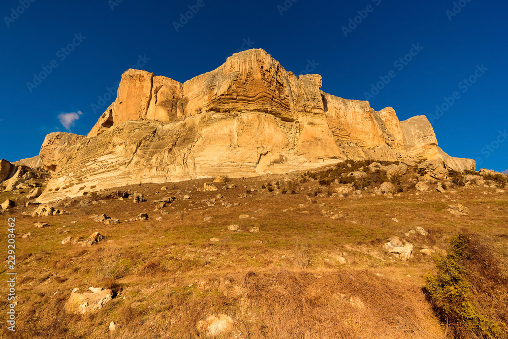 Alimova Balka Mountain, illuminated by the evening sun, Bakhchisaray district, Crimea, Russia Alimova Balka Mountain, illuminated by the evening sun, Bakhchisaray district, Crimea, Russia