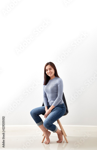 asian woman sitting on the chair