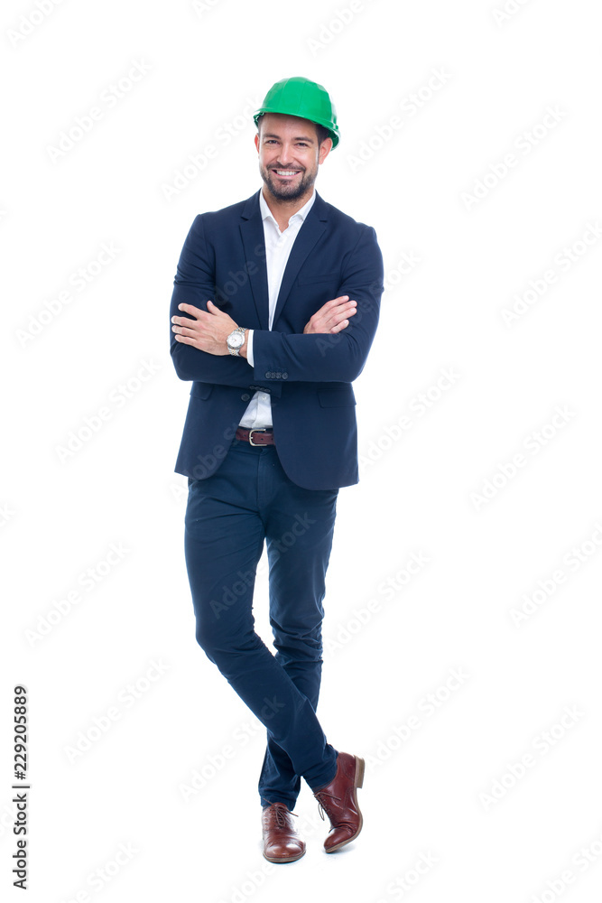 Confident engineer in green helmet and formal wear posing isolated Confident engineer in green helmet and formal wear posing isolated