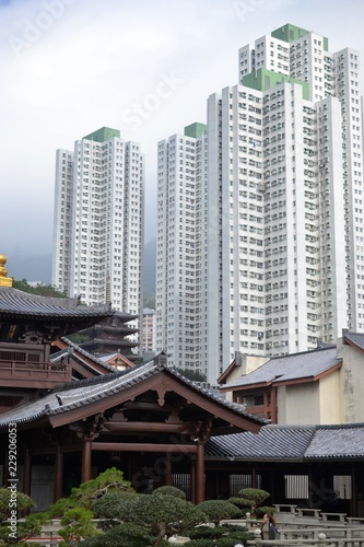 Chinese temple with skyscrapers in Nan Lian Garden, Hong Kong © graceenee