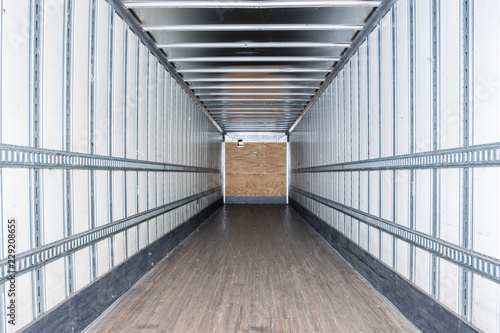Interior view of empty semi truck dry van commercial trailer photo