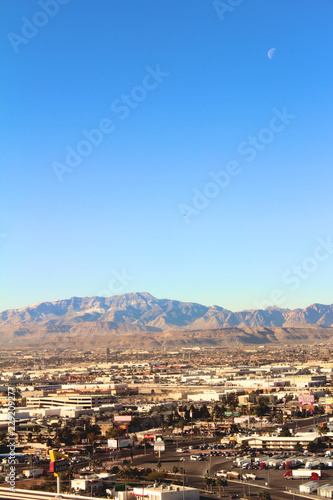 Photography Aerial view of the Las Vegas with mountains and plane and moon at day