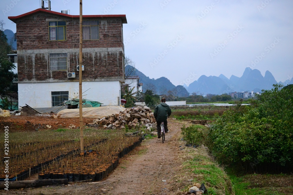 Bike tours and cycling to villages around Yangshuo, Guilin, Guangxi with beautiful karst landscape in China