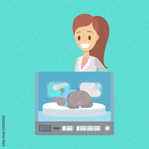 Newborn child in the hospital incubator box
