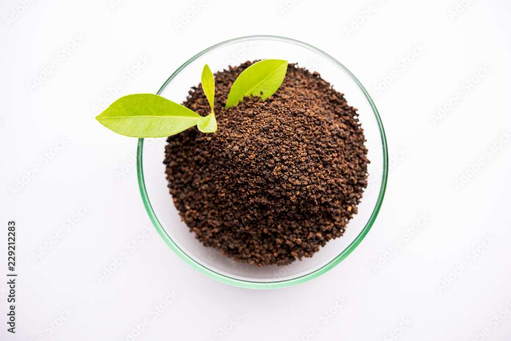 Black Tea Powder or dry dust with or without green leaf and served hot chai in a cup Black Tea Powder or dry dust with or without green leaf and served hot chai in a cup