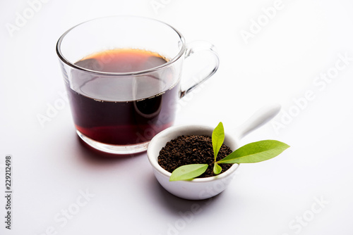 Black Tea Powder or dry dust with or without green leaf and served hot chai in a cup