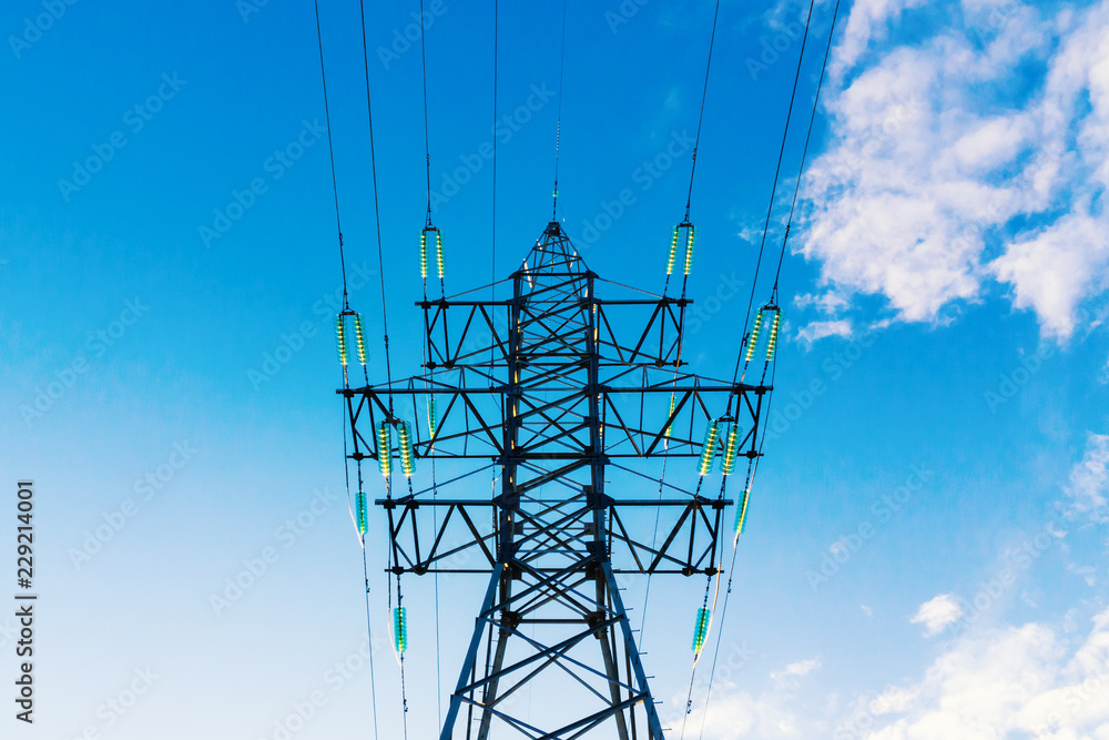 Power transmission pylon against blue sky Power transmission pylon against blue sky