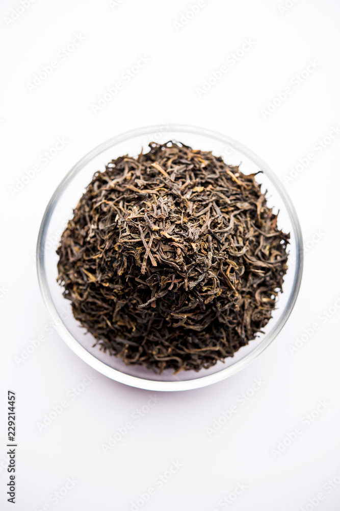 Black Tea Powder or dry dust with or without green leaf and served hot chai in a cup Black Tea Powder or dry dust with or without green leaf and served hot chai in a cup