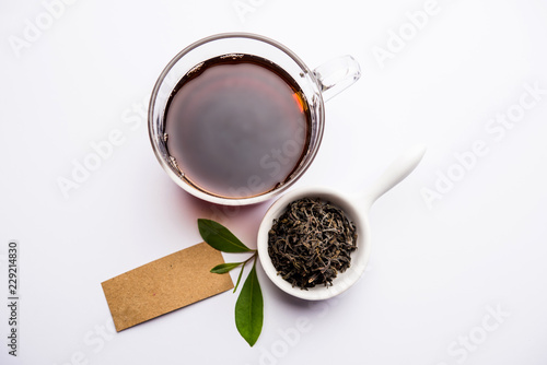 Black Tea Powder or dry dust with or without green leaf and served hot chai in a cup