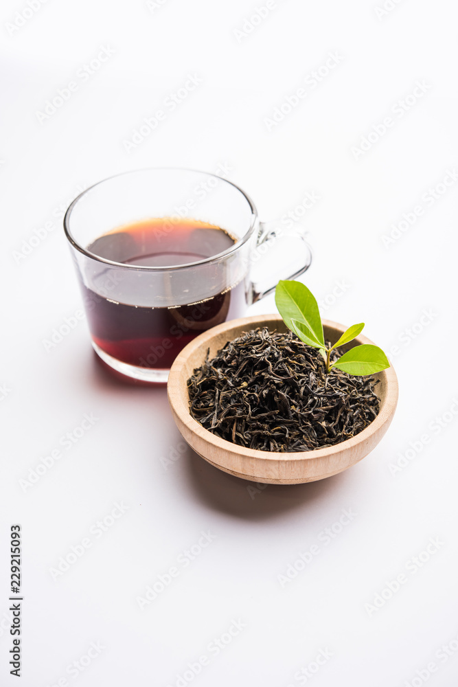 Black Tea Powder or dry dust with or without green leaf and served hot chai in a cup Black Tea Powder or dry dust with or without green leaf and served hot chai in a cup