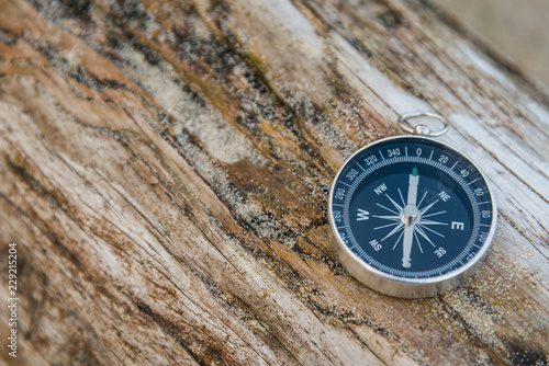 Compass on wooden rustic background