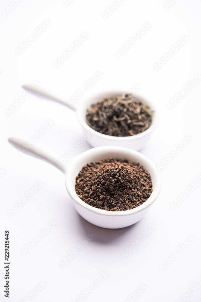 Black Tea Powder or dry dust with or without green leaf and served hot chai in a cup Black Tea Powder or dry dust with or without green leaf and served hot chai in a cup