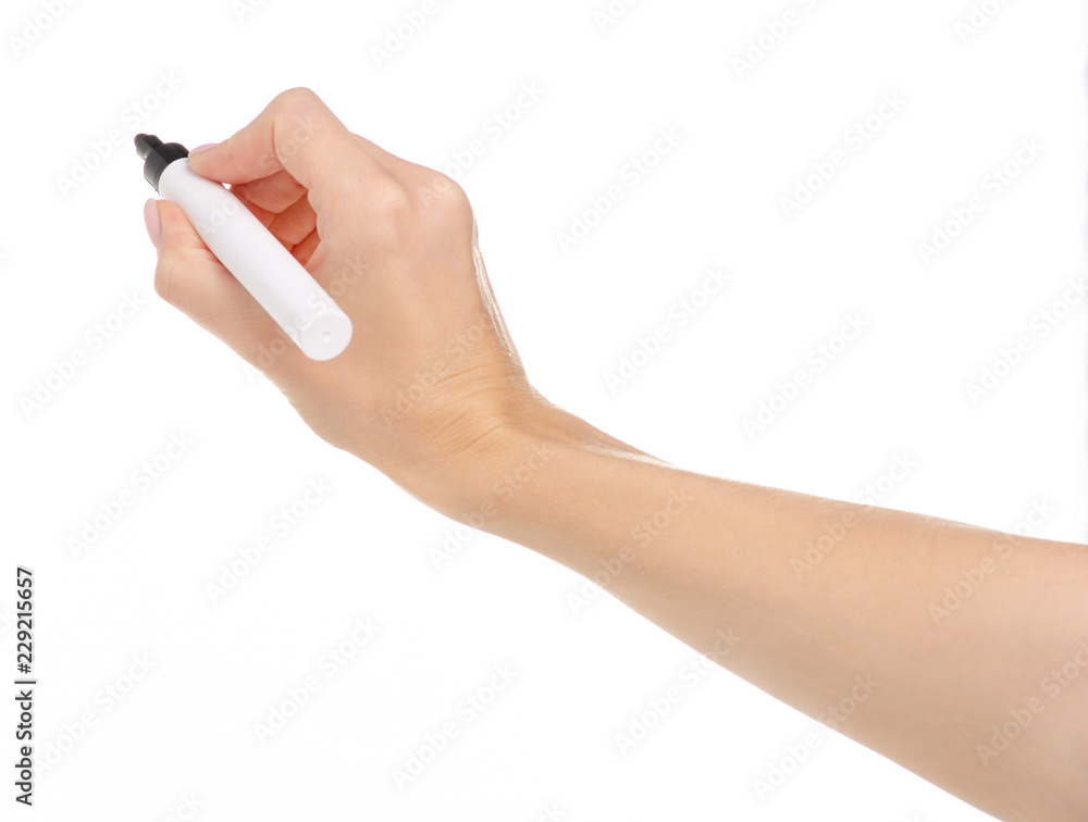 Black marker in hand on a white background. Isolation Black marker in hand on a white background. Isolation