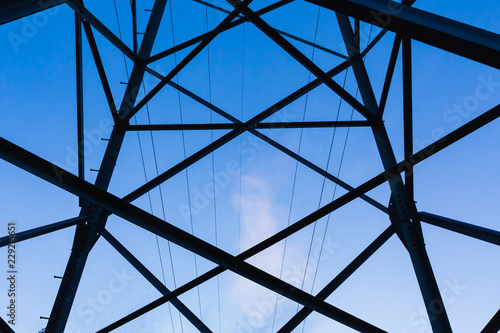 Power transmission pylon against blue sky