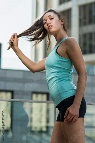 Playful sporty young woman outdoors