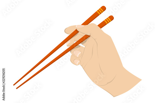 Hand holding asian chinese couple of chopstick